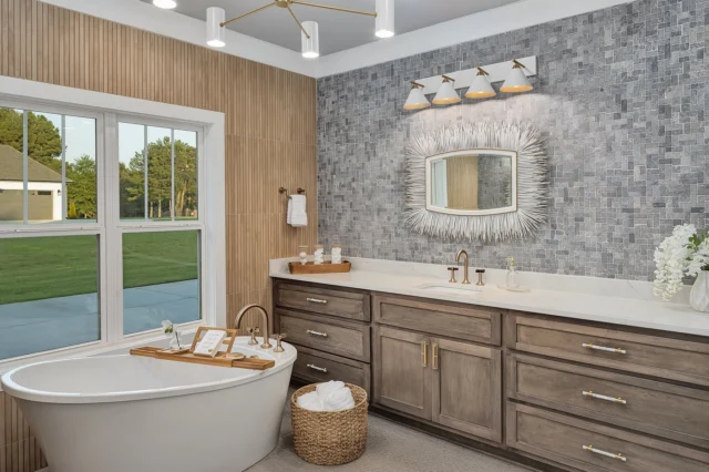 Step into this primary bathroom retreat where earthy sophistication takes center stage. We layered a natural stone backsplash with custom-mix stained cabinetry for rich, warm dimension.

The alligator skin pattern floors add a touch of bold intrigue underfoot, while sculptural white and gold lighting keeps the atmosphere soft and serene. Japanese wood-inspired tile wraps the walls around the tub, bringing a sense of warmth and spa-like calm.

And the porcupine mirrors? They’re the perfect conversation starter, blending organic texture with a dose of playful glamour.

Because bathrooms should feel as curated as the rest of your home—layered, tactile, and unapologetically personal.

Designed + Built by RB Interiors
Photo: @launchpad_usa 

#OrganicLuxury #BathroomDesign #TexturalInteriors #NaturalStone #CustomCabinetry #DesignDetails #rbinteriors #thebuildersdesigner