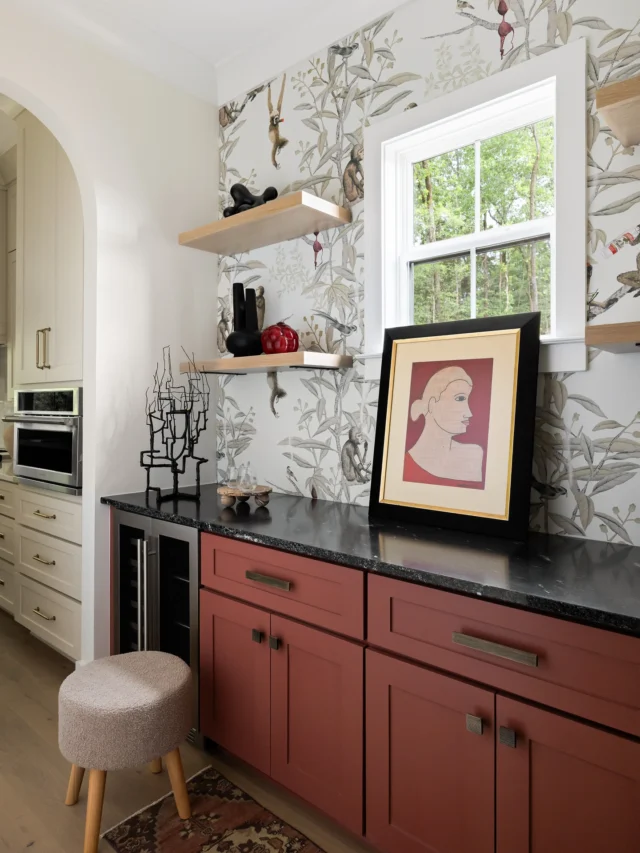 When your home exudes quiet luxury but your butler’s pantry insists on throwing a party…

For this new construction gem, we embraced a little whimsy among the refinement. The star of the show? A cheeky wallpaper alive with mischievous monkeys—tipsy on wine, mid-brawl, and living their best lives.

To complement this playful backdrop, we color-matched the built-ins to that perfect rich tomato red, layered in honed soapstone countertops, and topped it all with white oak shelves to keep things grounded (or as grounded as tipsy monkeys allow).

This pantry proves that luxury doesn’t have to take itself too seriously—and sometimes the smallest spaces make the biggest statements.

Designed + Furnished by RB Interiors
Built by: @vanguardcustomhomeshsv 
Photo: @kevinbrost 

#rbinteriors #thebuildersdesigner 
#QuietLuxury #ButlersPantry #DesignWithPersonality #RBInteriors #NewConstruction #SoapstoneCountertops #LuxuryHomeDesign